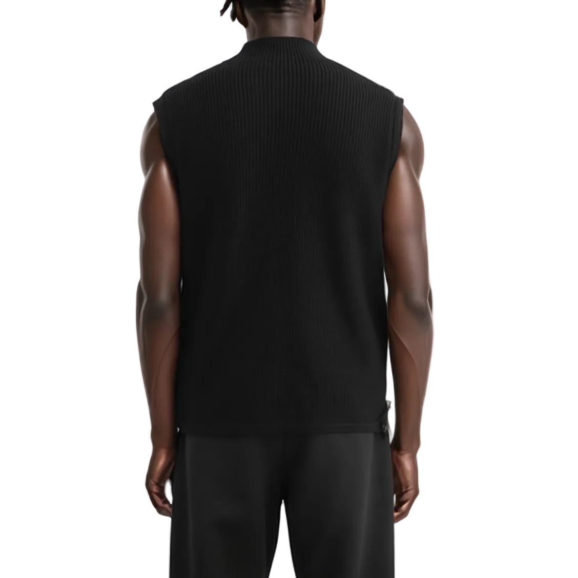 Person wearing a black sleeveless sweater on a white background