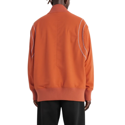 Orange jacket with white piping on a white background