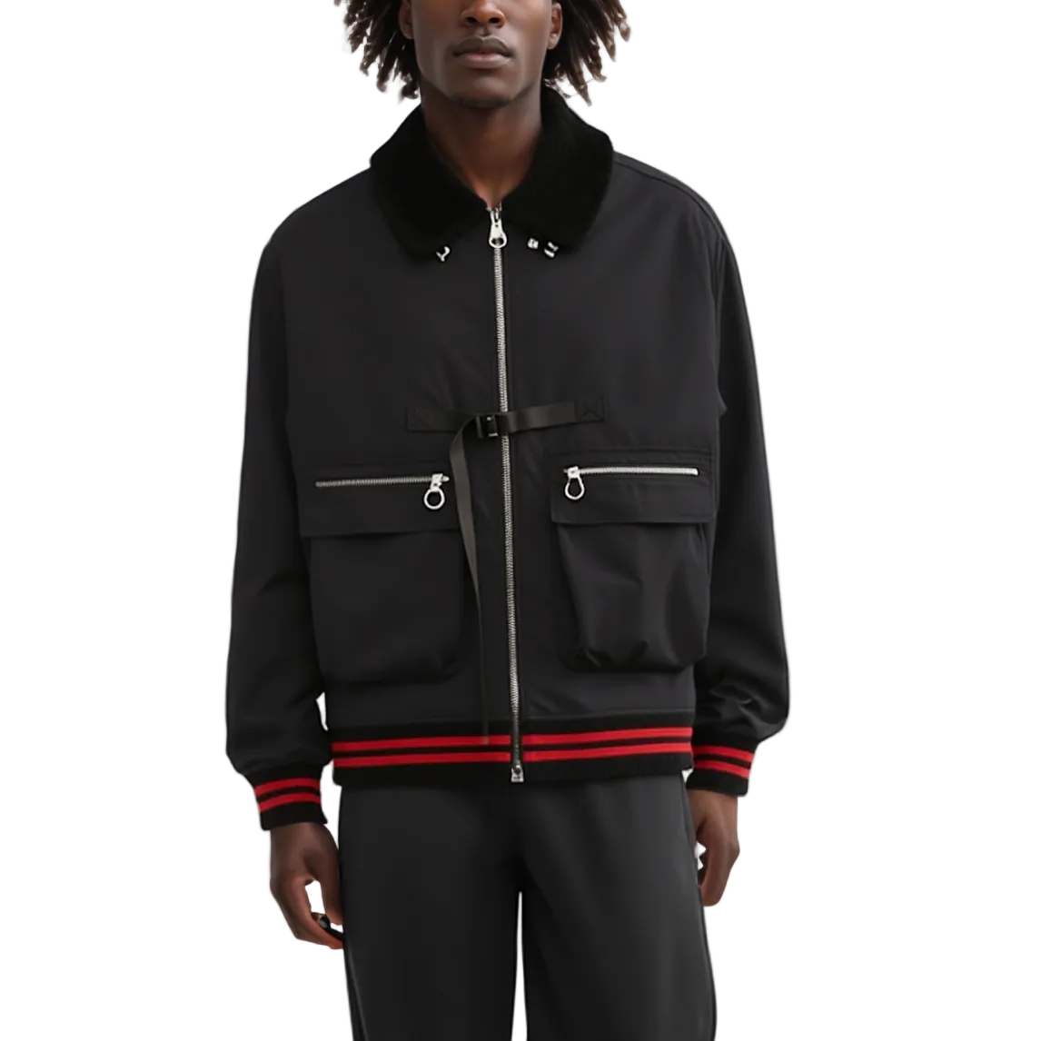 Person wearing a black jacket with red accents on a white background