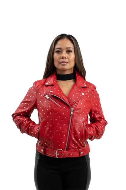 A woman modeling a red faux leather motorcycle jacket covered in silver studs, paired with a black top and black pants, against a plain white background.