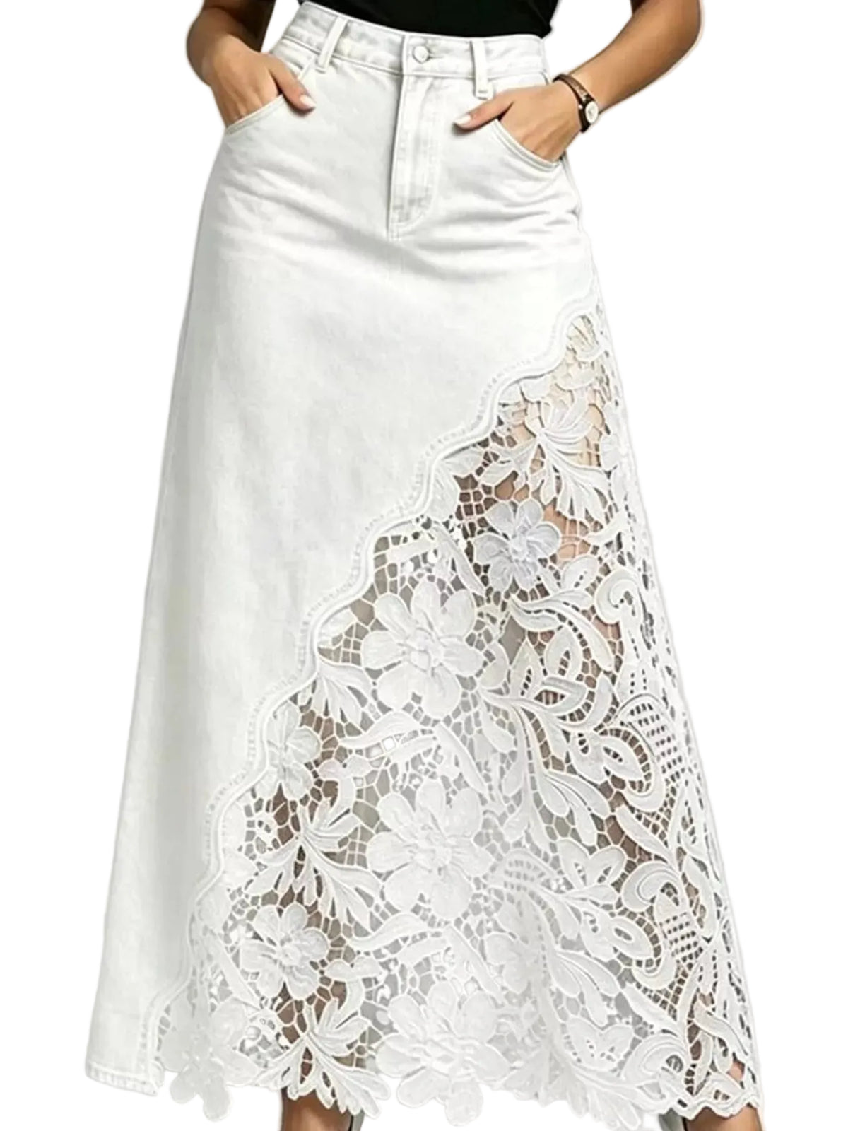 White denim midi skirt with a large floral lace overlay panel on the front, shown on a model with hands in pockets against a light gray background.