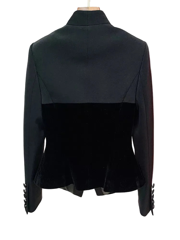 Black color-block blazer with a velvet lower half and structured shoulders, shown from the back on a mannequin against a white background.