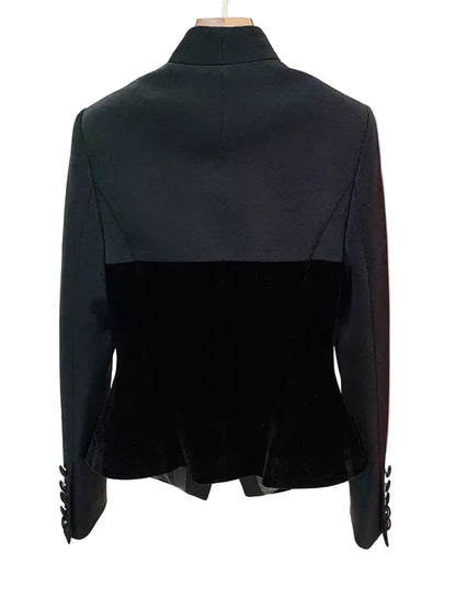 Black color-block blazer with a velvet lower half and structured shoulders, shown from the back on a mannequin against a white background.