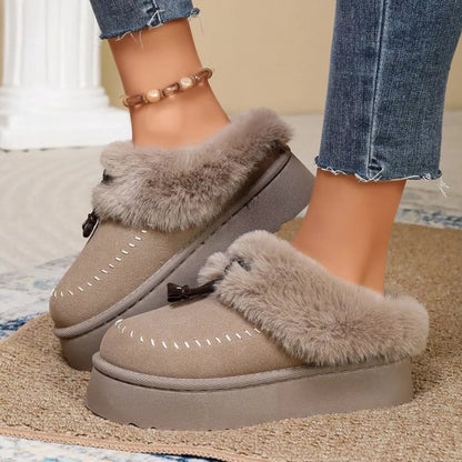 Plush faux fur-lined platform slippers with tassel detail