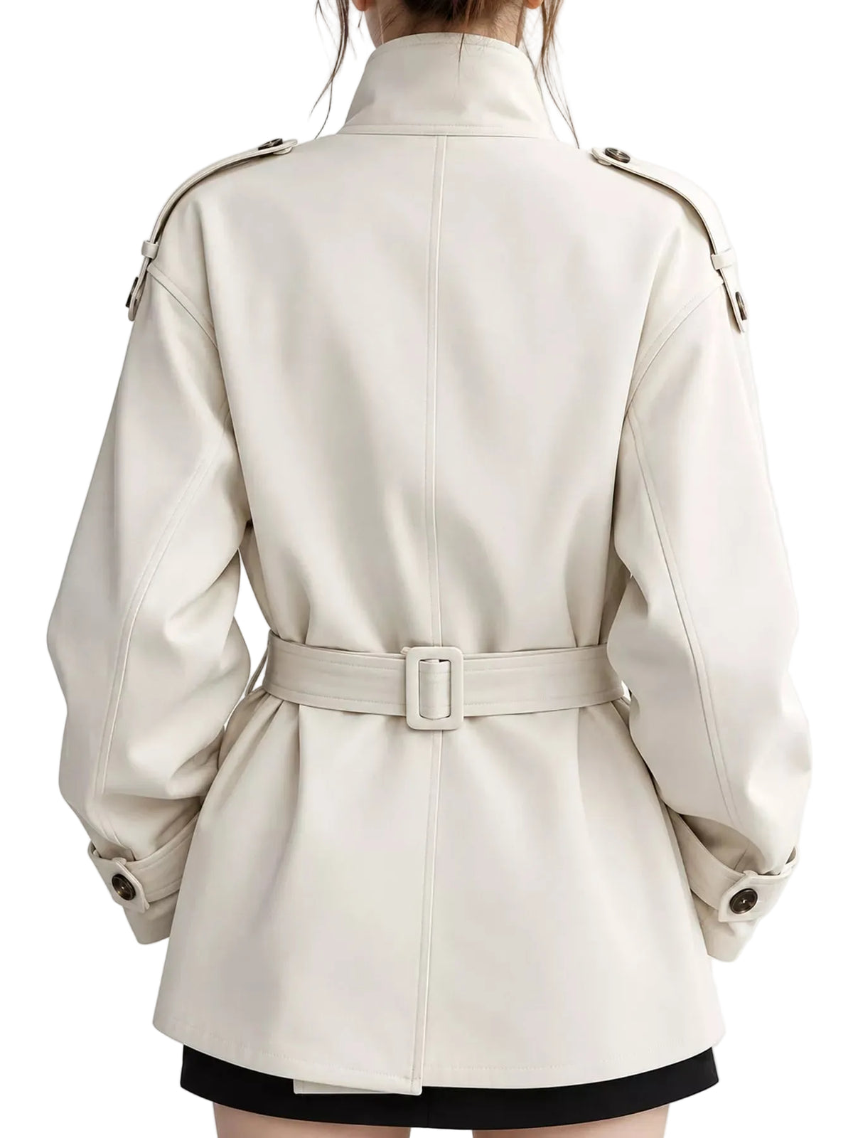 A person shown from the back wearing a cream-colored trench coat with a matching belt and silver-toned hardware, photographed against a plain light background.