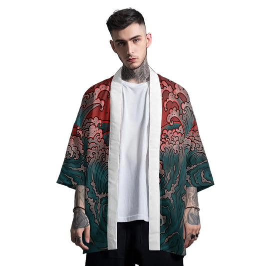 Man wearing a colorful kimono-style garment over a white shirt on a gray background