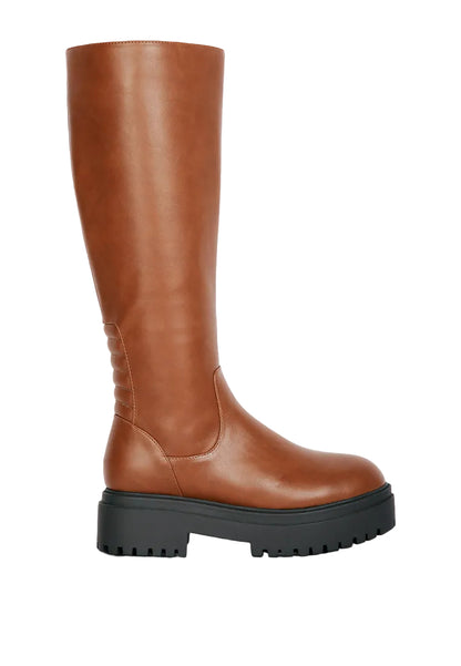 Brown knee-high boot with a thick sole on a light gray background