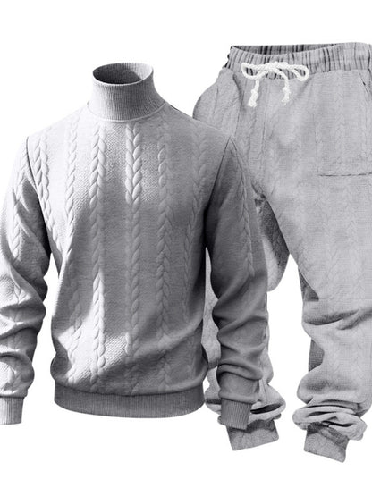 A light gray two-piece knit loungewear set featuring a mock-neck cable-knit sweater and matching drawstring sweatpants, displayed on a white background.