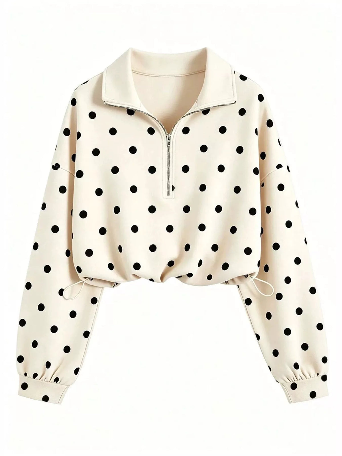 A cream-colored long-sleeve quarter-zip pullover sweatshirt with a black polka dot pattern, featuring a mock neck collar and elasticized cuffs.
