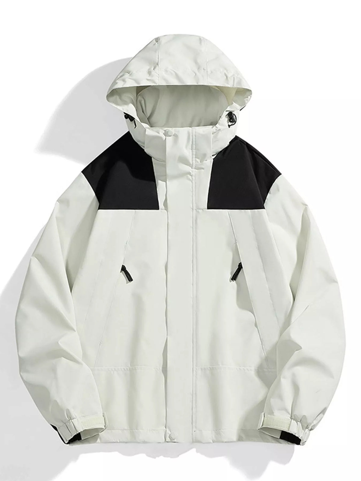 A hooded colorblock jacket in off-white and black, displayed flat against a white background with soft shadows.