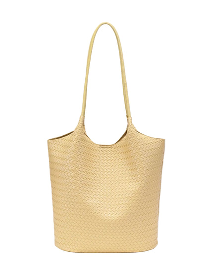 A light yellow woven leather tote bag with a single shoulder strap, shown against a solid gray background.