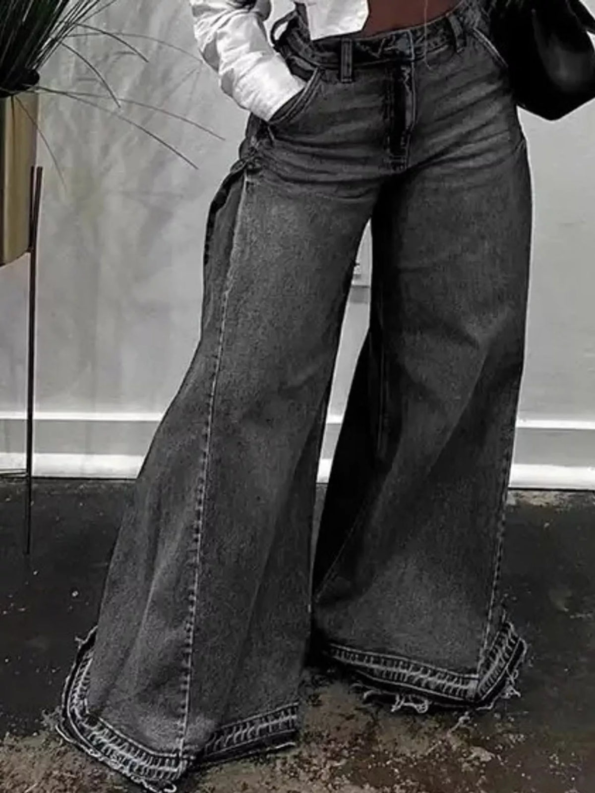 High-waisted wide-leg statement jeans with side panel detailing