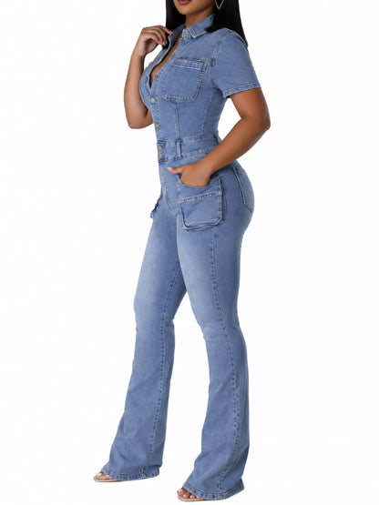 A woman modeling a light blue denim one-piece jumpsuit with short sleeves, a buttoned chest, and wide-leg flared pants, shown against a plain white background.