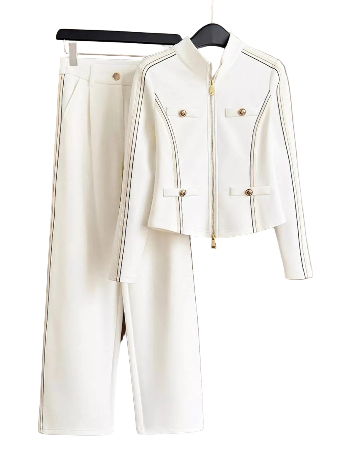 An off-white two-piece women's suit set consisting of a cropped zip-front jacket with gold-tone buttons and piping, and matching wide-leg trousers, hanging on a black hanger against a solid taupe background.