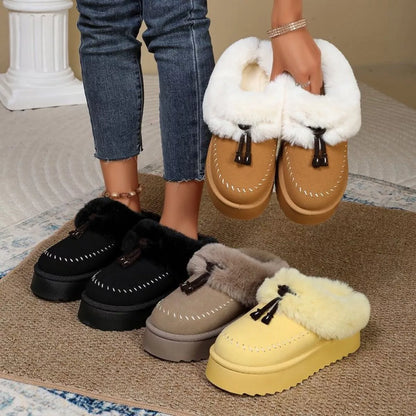 Plush faux fur-lined platform slippers with tassel detail