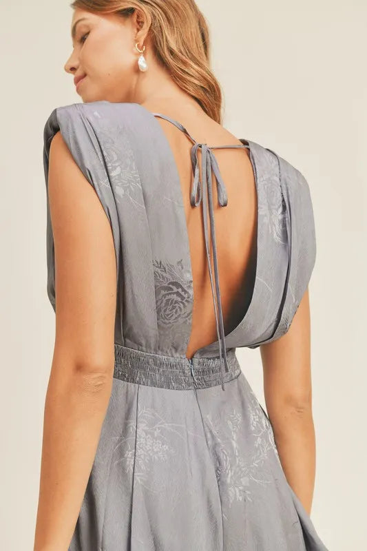 Draped Romper with Pleated Shoulder Pad Detail.