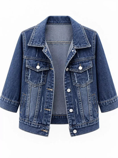 A blue denim jacket with a pointed collar, button front, and flap chest pockets, shown on a plain white background.