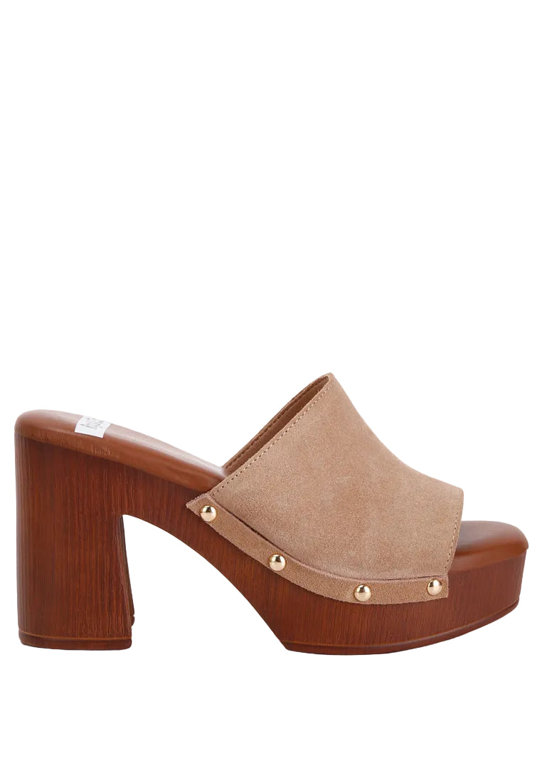 Brown platform sandal with wooden block heel on a white background