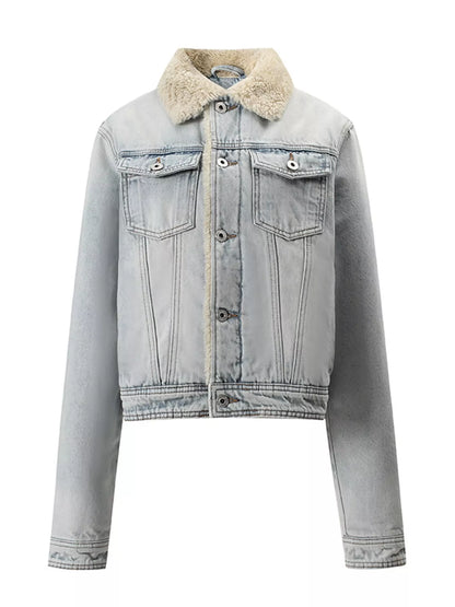 A cropped light-wash denim jacket featuring a beige sherpa fleece collar, button-front closure, and two chest flap pockets, shown on a plain white background.