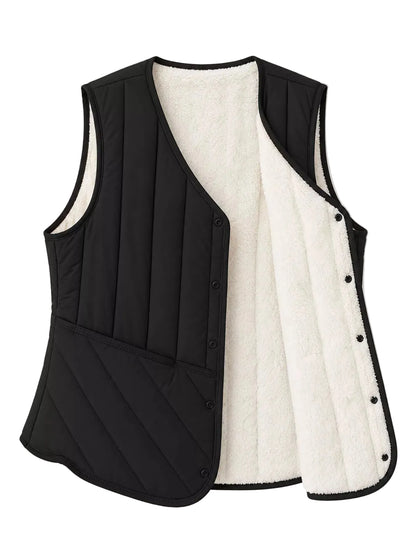 A black quilted vest with a plush white sherpa lining, shown open against a clean white background.