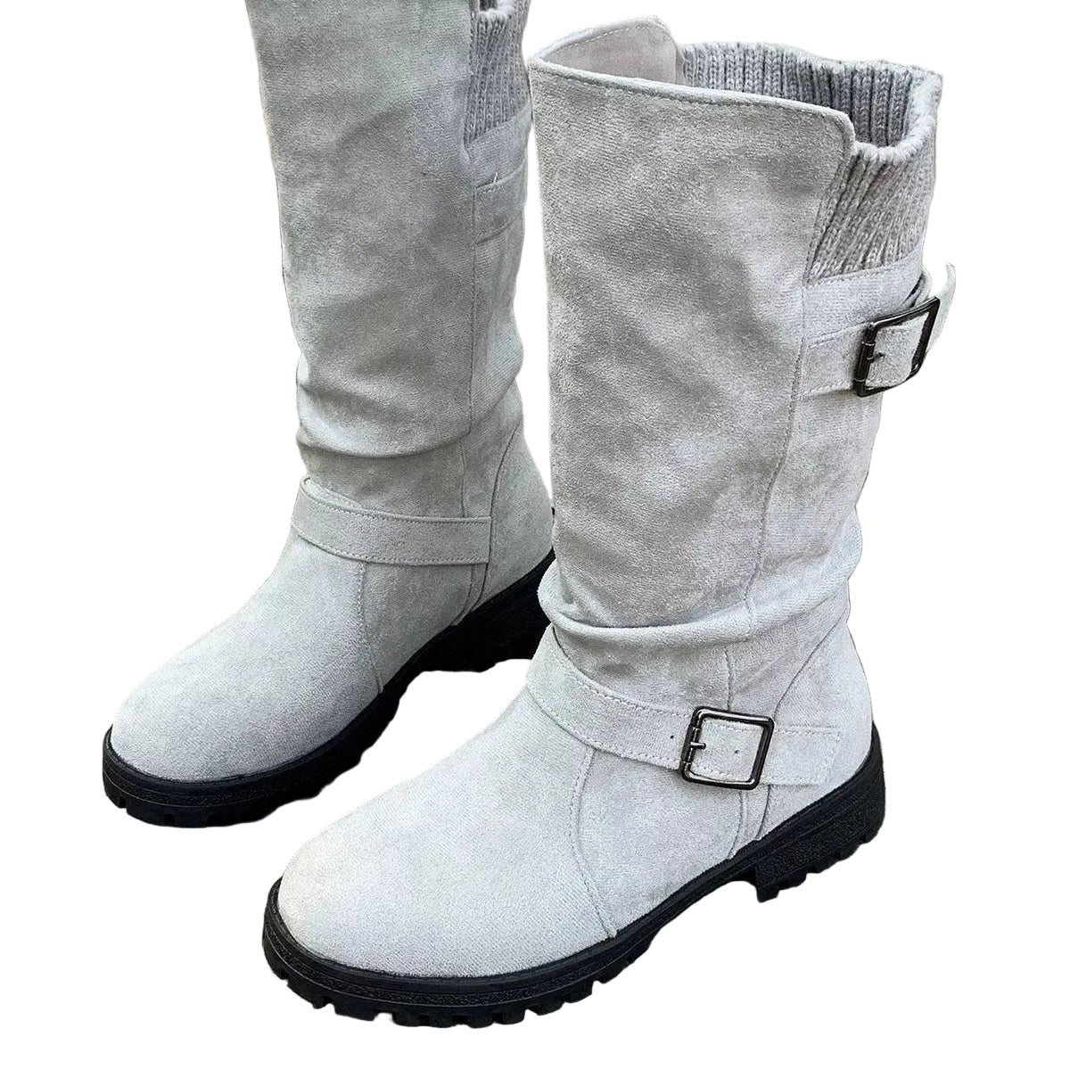 A pair of light gray suede-like mid-calf boots with black soles and silver buckle straps, shown standing on weathered wooden planks.