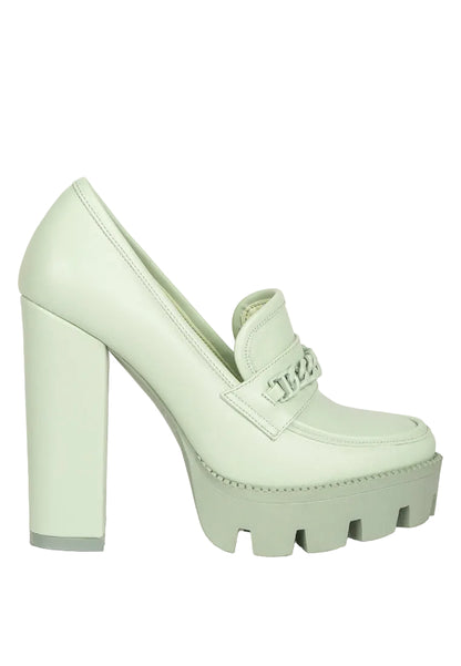 Mint green platform shoe on a white background