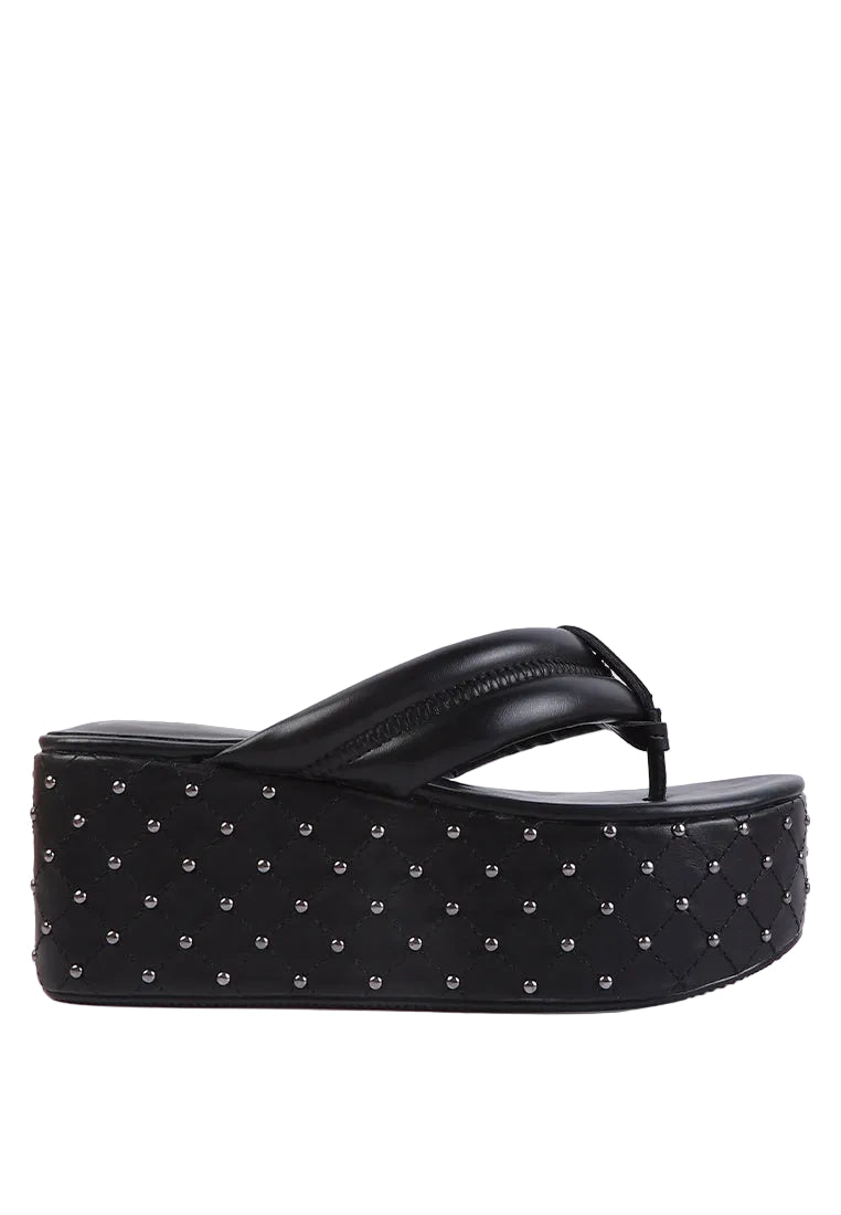 Black studded platform sandal on a white background