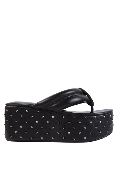 Black studded platform sandal on a white background