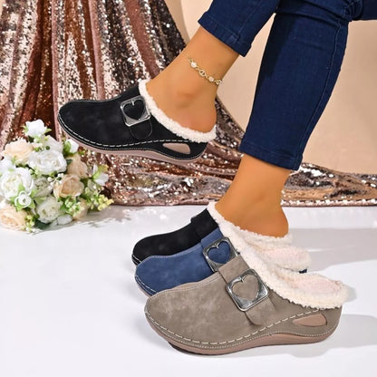 Faux fur-lined slip-on shoes with heart buckle