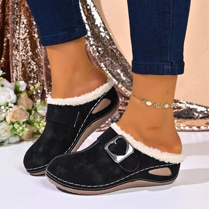 Faux fur-lined slip-on shoes with heart buckle