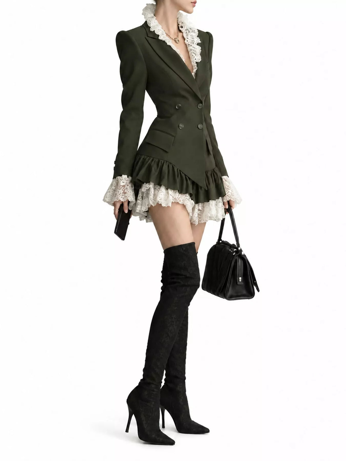 A model is shown from the neck down wearing a dark brown double-breasted mini blazer with white lace trim, black over-the-knee boots, and holding a black handbag against a plain white background.