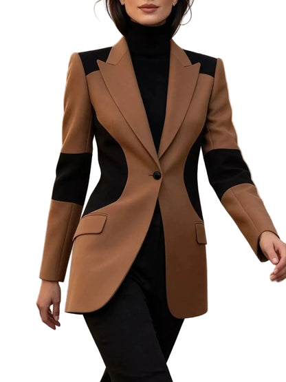 A woman walking on a cobblestone street wearing a color-block blazer in camel brown and black over a black turtleneck sweater.