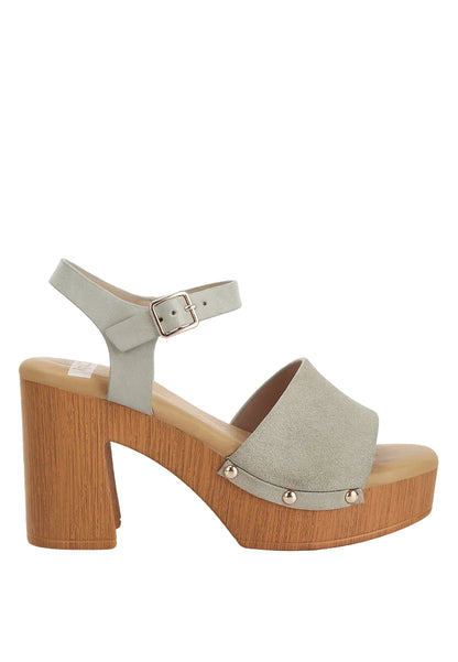 Gray sandal with wooden platform sole on a white background