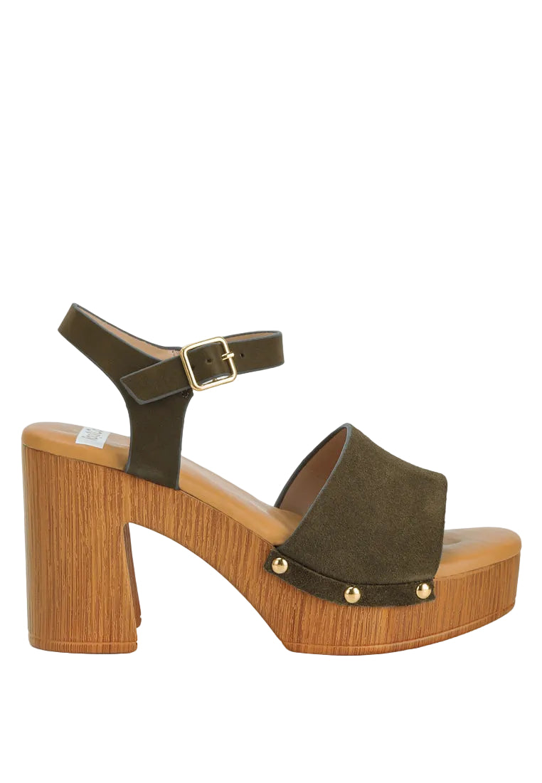 Brown platform sandal with wooden sole on a white background