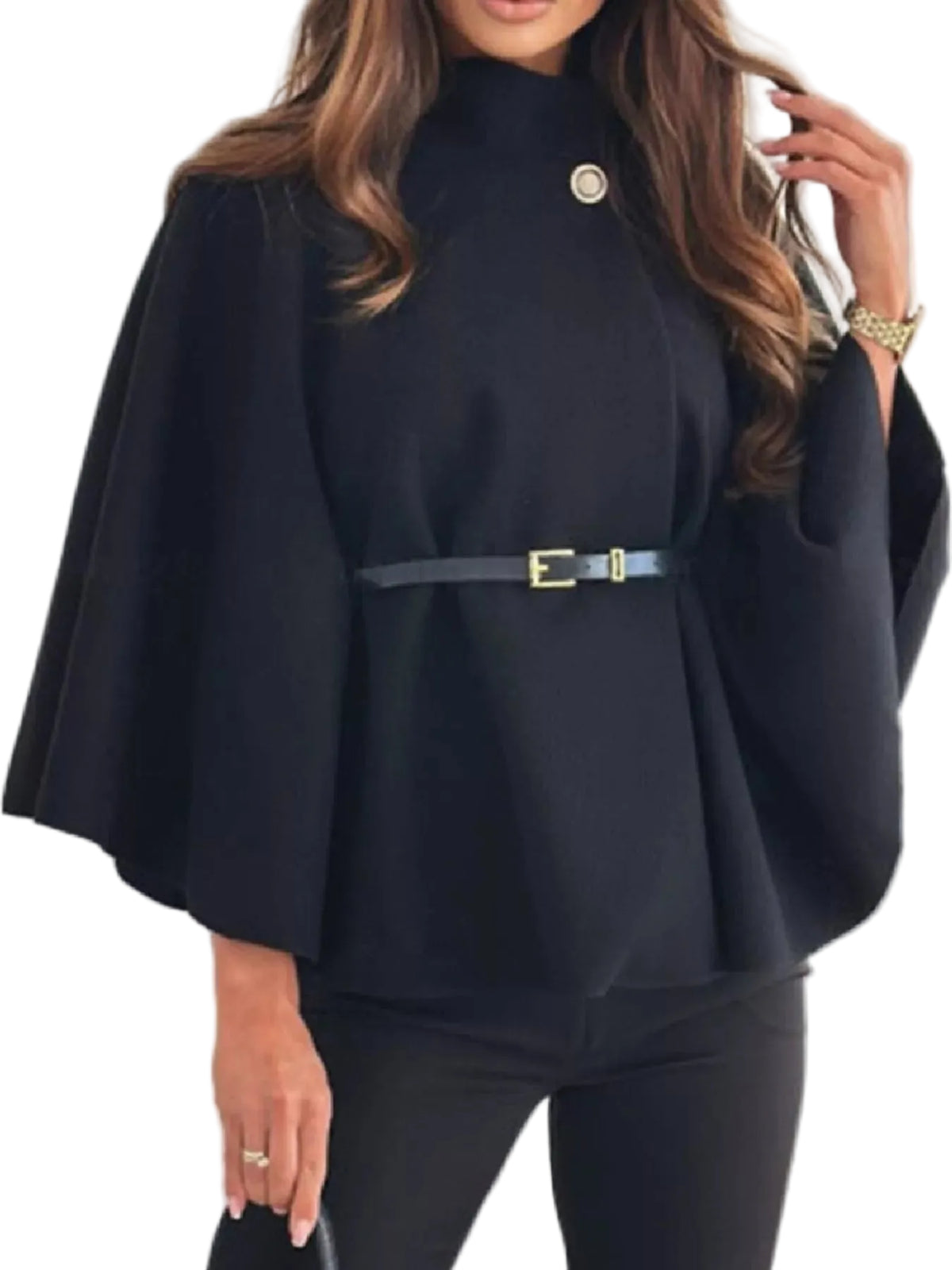 A woman wearing a black high-neck cape-sleeve top with a matching black belt featuring a gold buckle, paired with black pants.