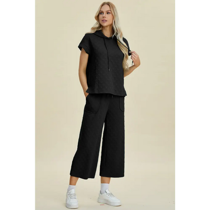 Double Take Full Size Texture Drawstring Short Sleeve Hoodie and Pocketed Pants Set.