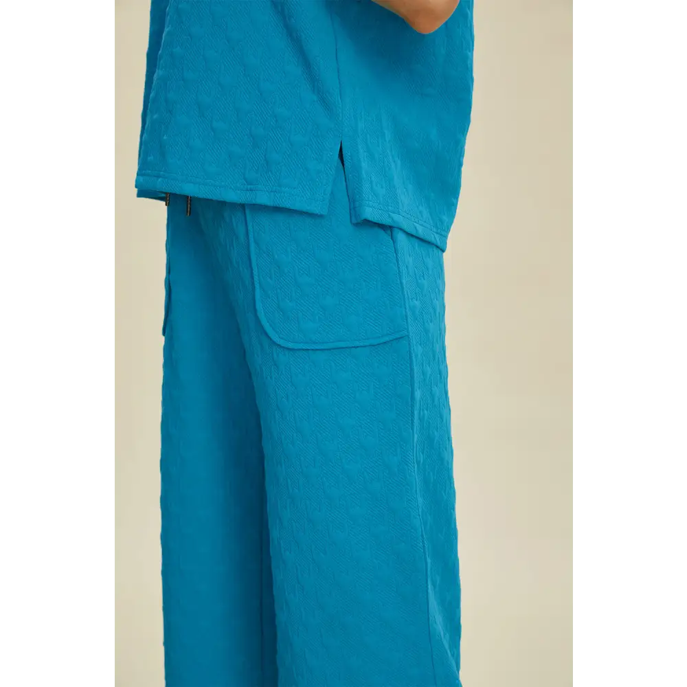 Double Take Full Size Texture Drawstring Short Sleeve Hoodie and Pocketed Pants Set.