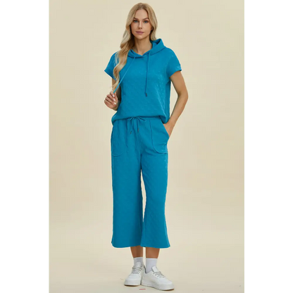 Double Take Full Size Texture Drawstring Short Sleeve Hoodie and Pocketed Pants Set.