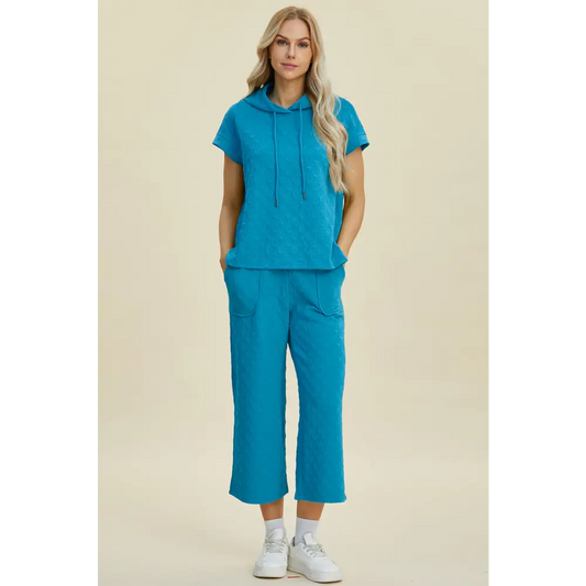 Double Take Full Size Texture Drawstring Short Sleeve Hoodie and Pocketed Pants Set.