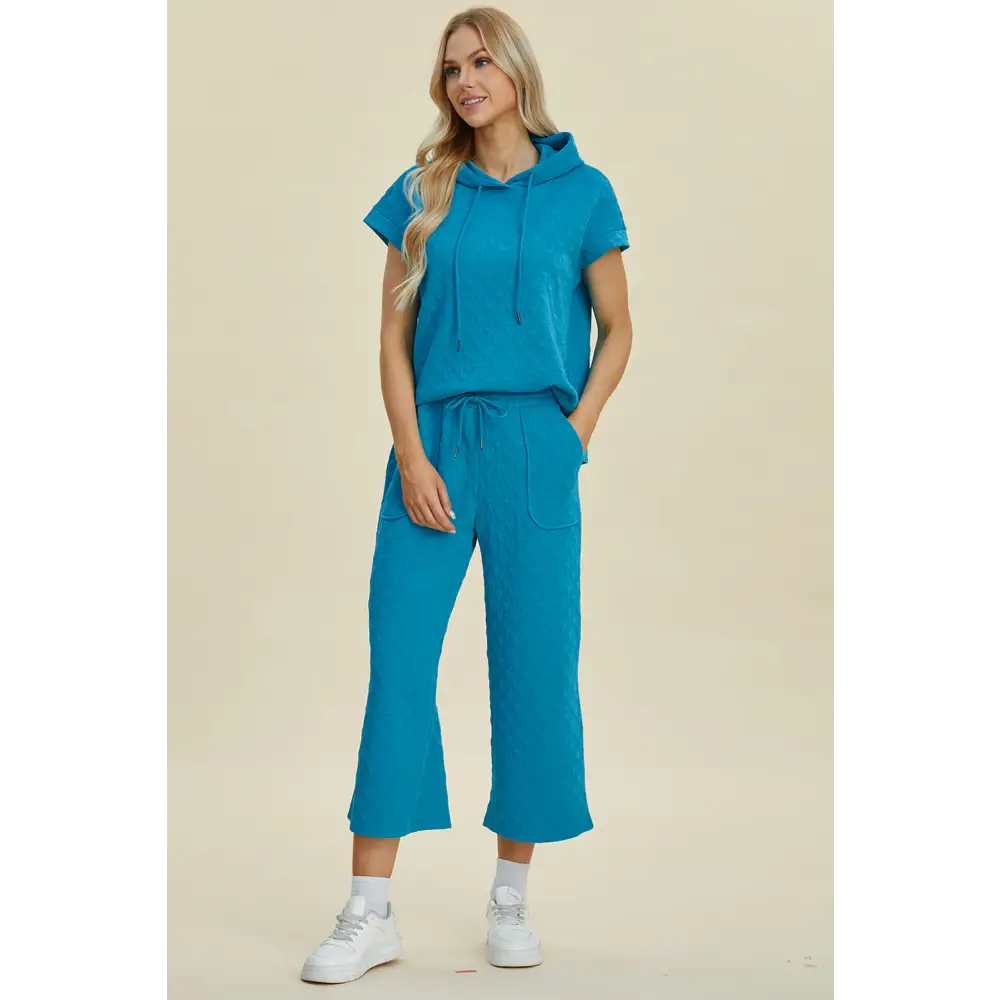 Double Take Full Size Texture Drawstring Short Sleeve Hoodie and Pocketed Pants Set.