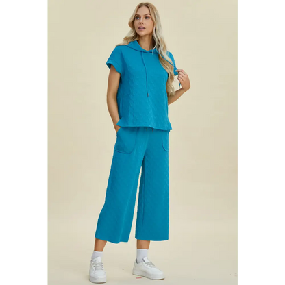 Double Take Full Size Texture Drawstring Short Sleeve Hoodie and Pocketed Pants Set.