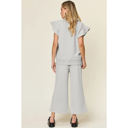 Double Take Texture Ruffle Short Sleeve Top and Drawstring Wide Leg Pants Set.