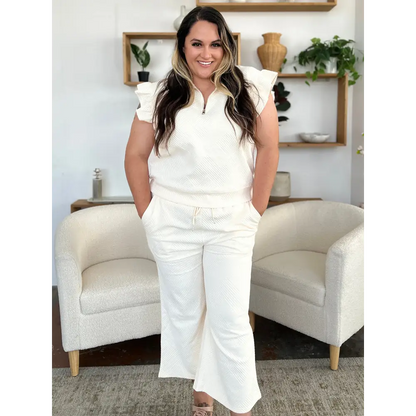 Double Take Texture Ruffle Short Sleeve Top and Drawstring Wide Leg Pants Set.