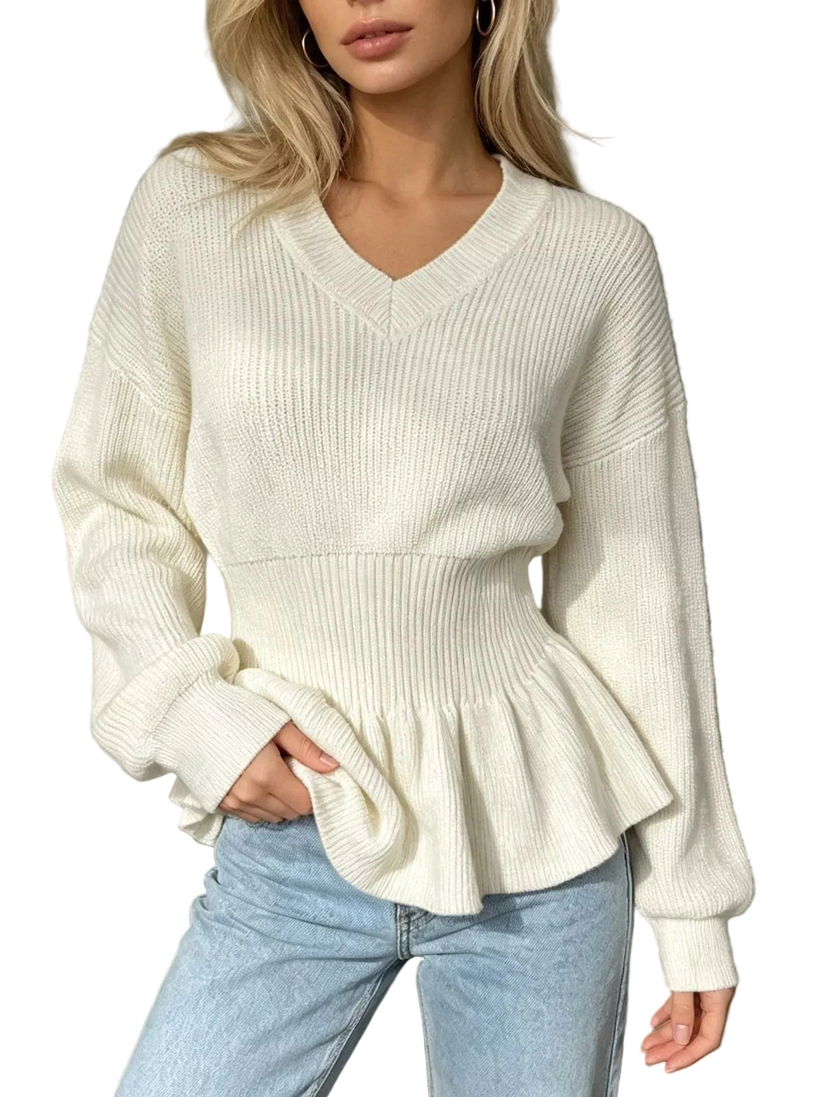 A woman wearing a cream-colored ribbed knit sweater with a V-neck and peplum hem, paired with light blue jeans.