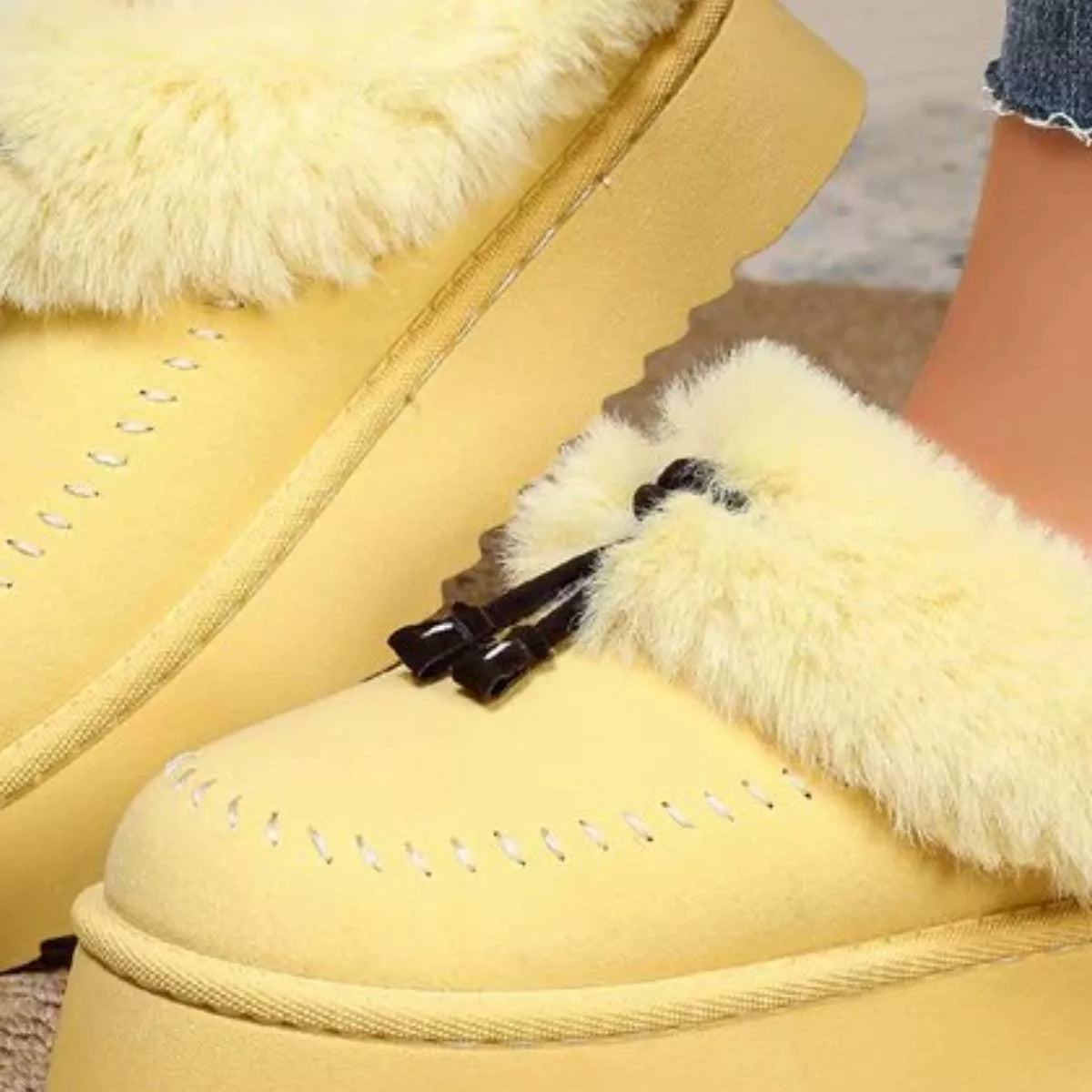 Plush faux fur-lined platform slippers with tassel detail