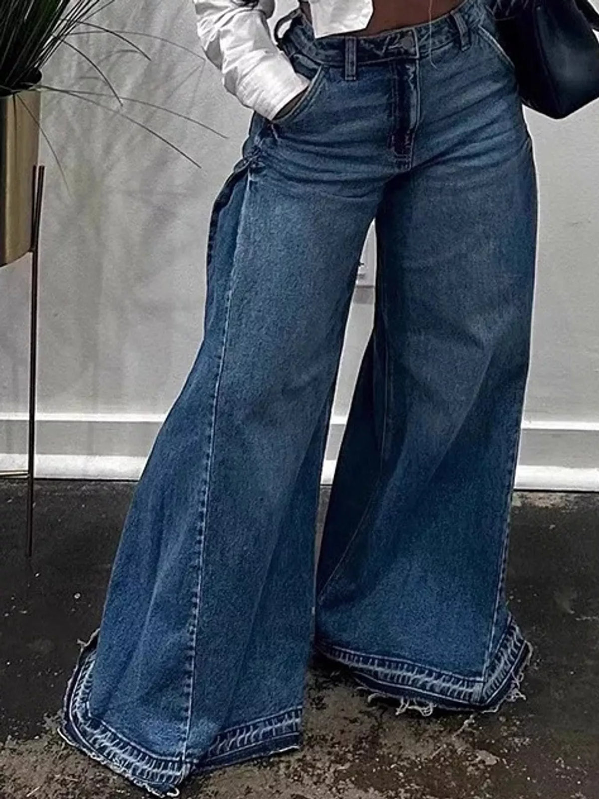 High-waisted wide-leg statement jeans with side panel detailing