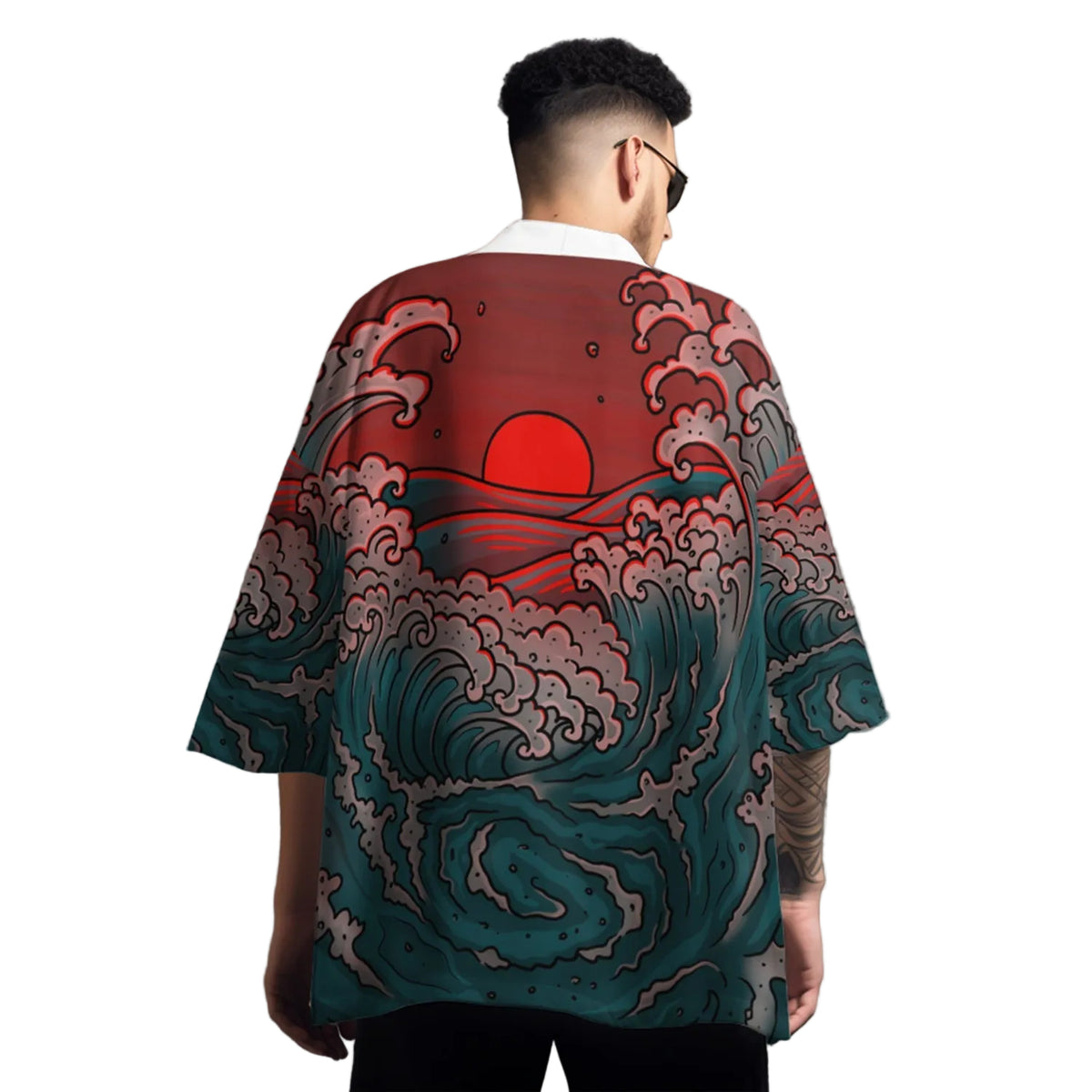 Person wearing a shirt with wave and sun design on a gray background