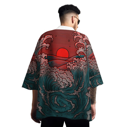 Person wearing a shirt with wave and sun design on a gray background