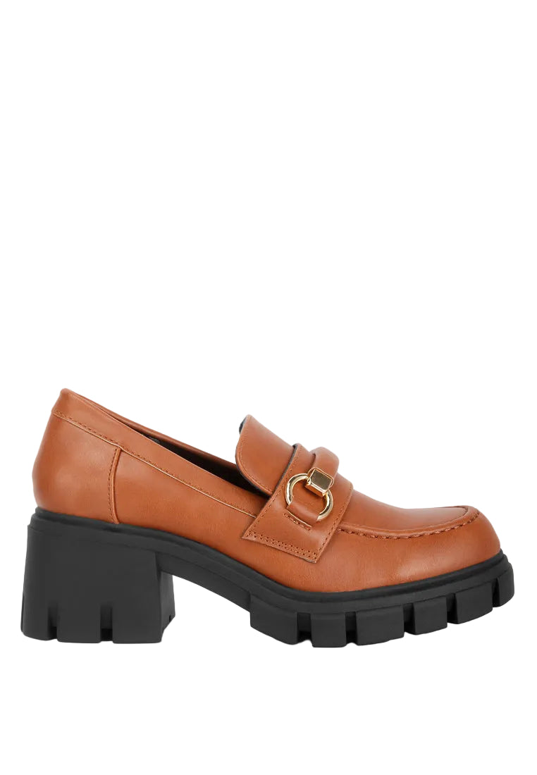 Brown leather loafer with gold buckle on a white background