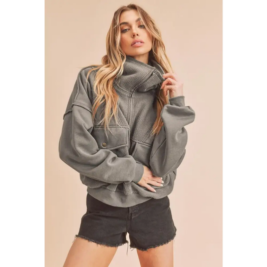 Exposed Seam Half Zip Sweatshirt with Pockets.